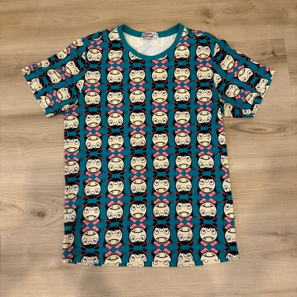 Devil Nut Under Red Flag women’s small tshirt three eye’d girl print in teal
